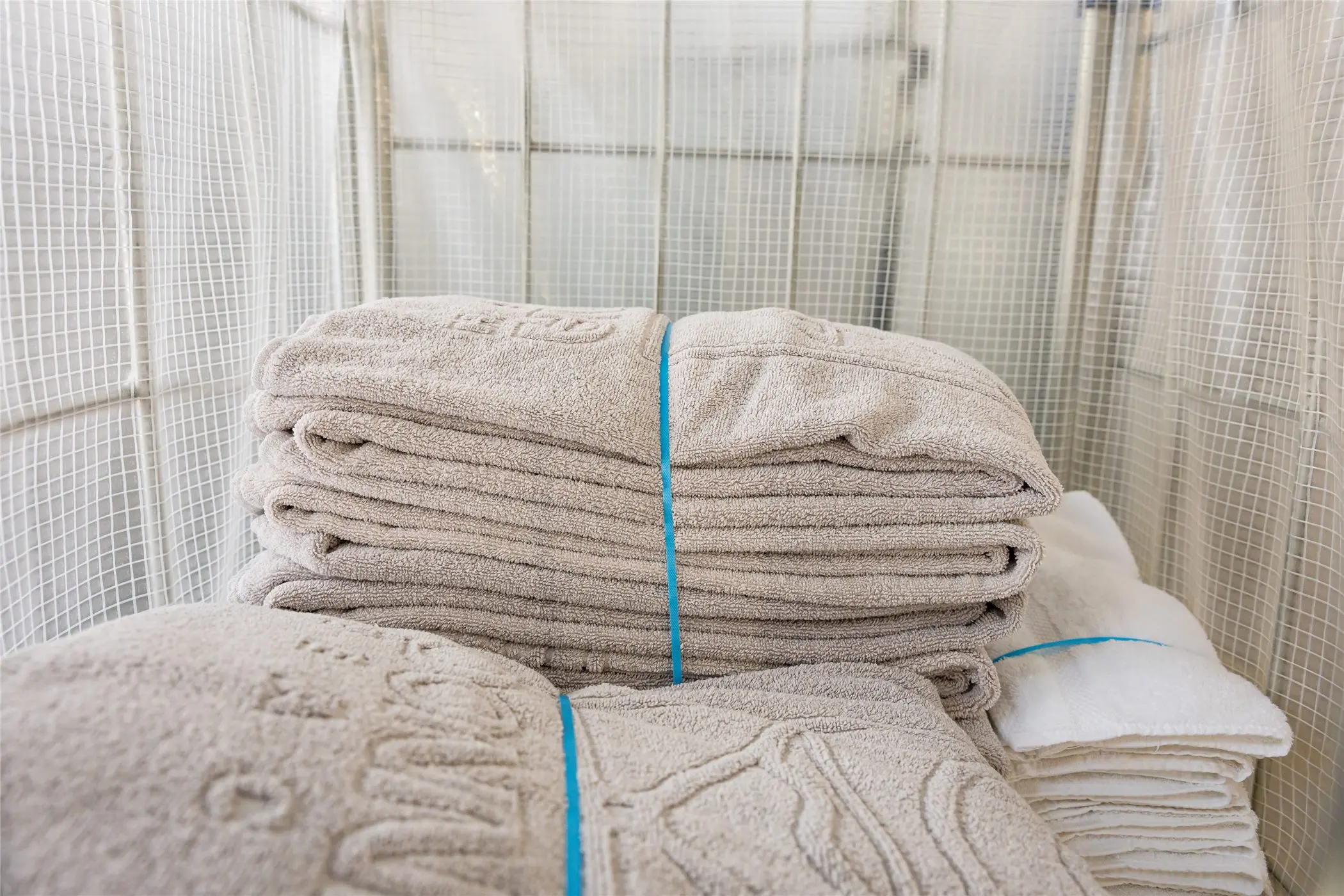 Towels folded and tied in a delivery cage